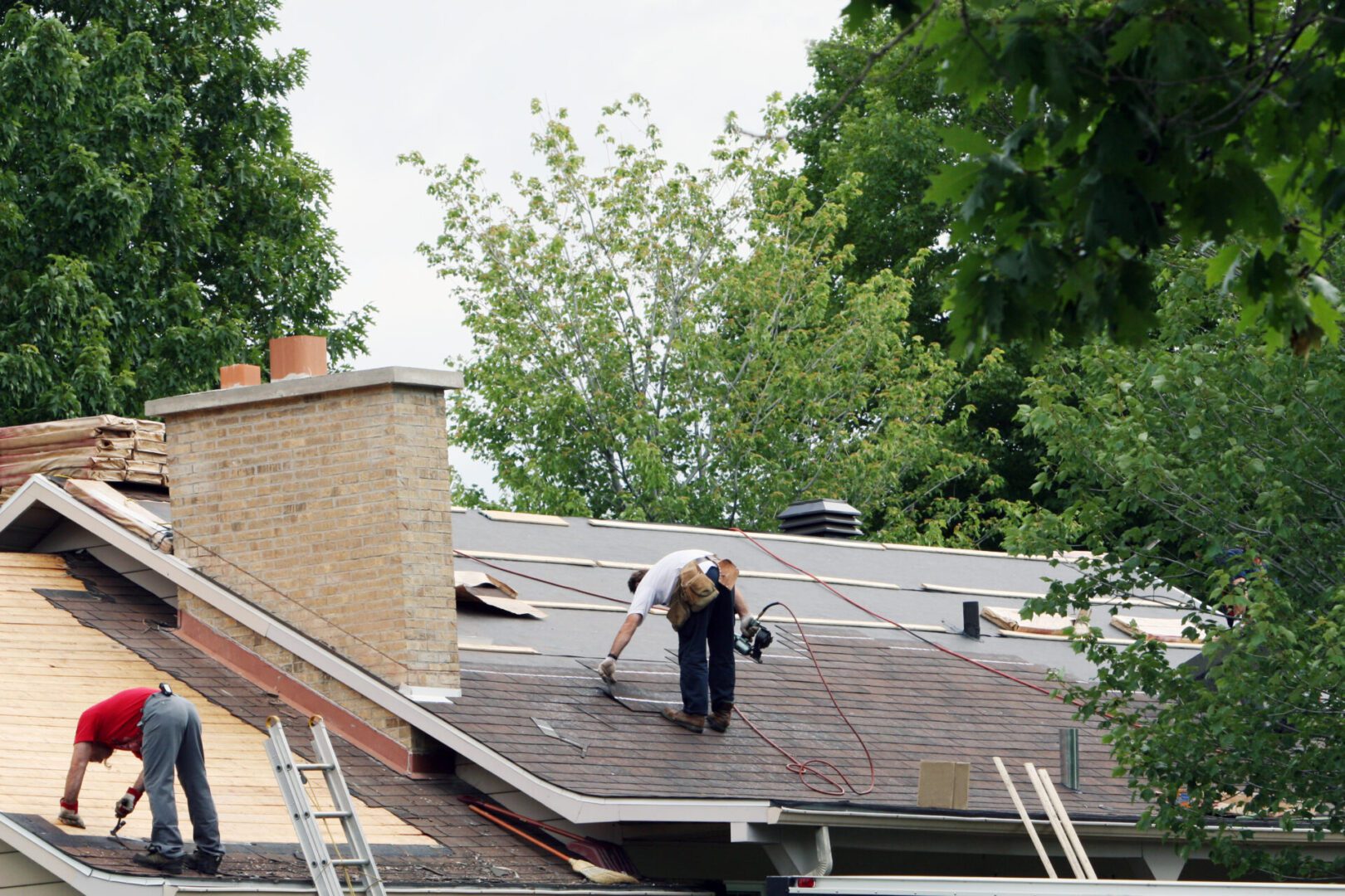 Roof maintenance with ladders and tools
