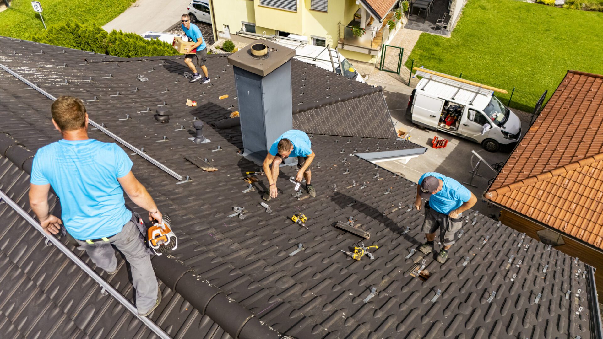 Roofers working on residential roof
